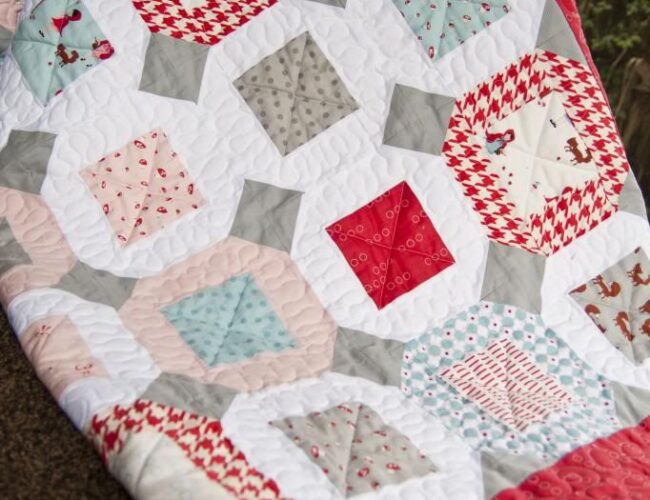 FREE PATTERN: Jumping Jacks jelly roll quilt pattern by Lella Boutique. Fabric is A Walk in the Wood by Aneela Hoey for Moda.