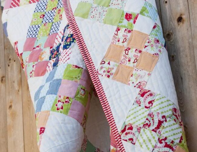 Niner jelly roll quilt PDF pattern by Camille Roskelley of Thimble Blossoms. Fabric is Scrumptious + Happy-Go-Lucky by Bonnie & Camille for Moda Fabrics.