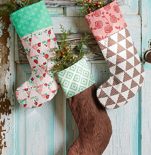 By the Chimney with Care stocking pattern by Lella Boutique. Digital pattern available in the December 2014 issue of American Patchwork & Quilting.