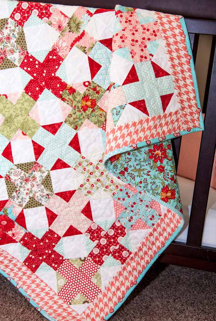 Hot Cross Buns baby quilt PDF pattern by Lella Boutique. Make it with a Jelly Roll or Layer Cake. Fabric is Bliss by Bonnie & Camille for Moda Fabrics.