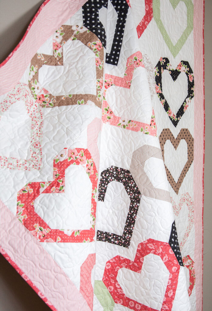 Open Heart quilt pattern by Lella Boutique. Make it with fat quarters or fat eighths. Fabric is Olive's Flower Market by Lella Boutique for Moda Fabrics.