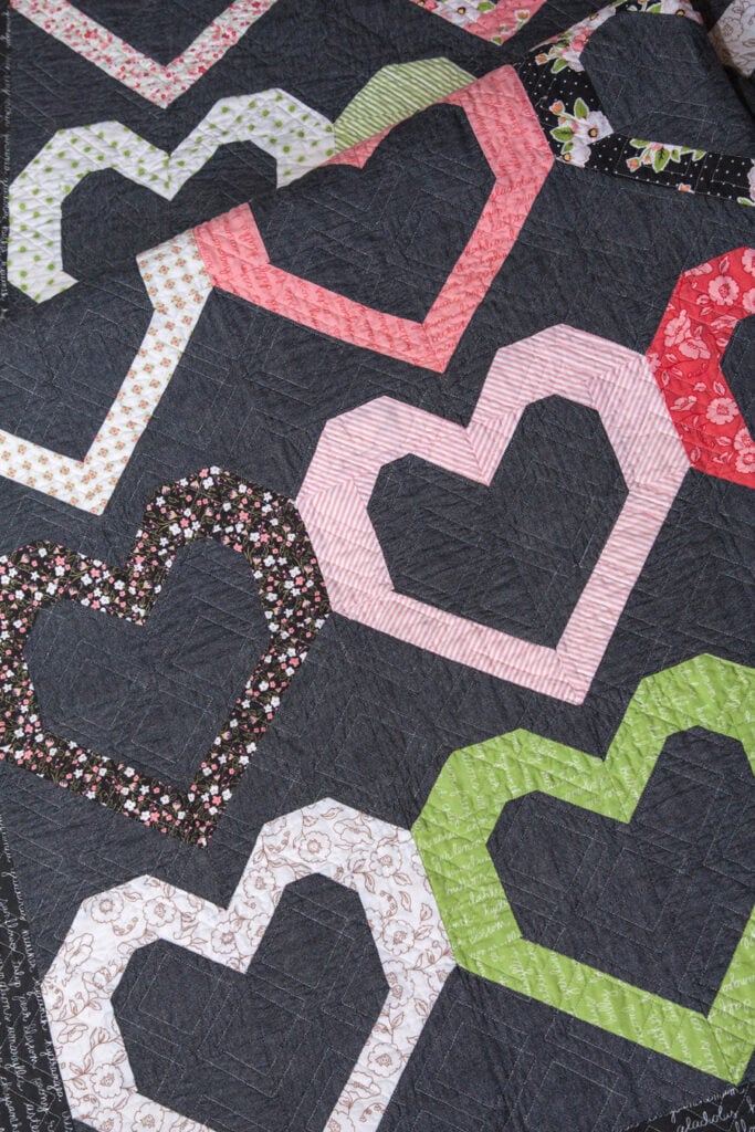 Open Heart quilt pattern by Lella Boutique. Make it with fat quarters or fat eighths. Fabric is Olive's Flower Market by Lella Boutique for Moda Fabrics.