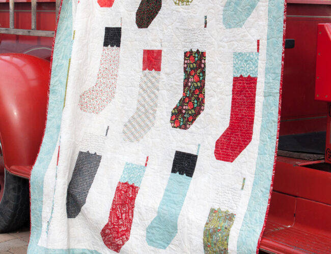 By the Chimney stocking quilt by Lella Boutique. Fat eighth friendly. Fabric is Juniper Berry by BasicGrey for Moda Fabrics.