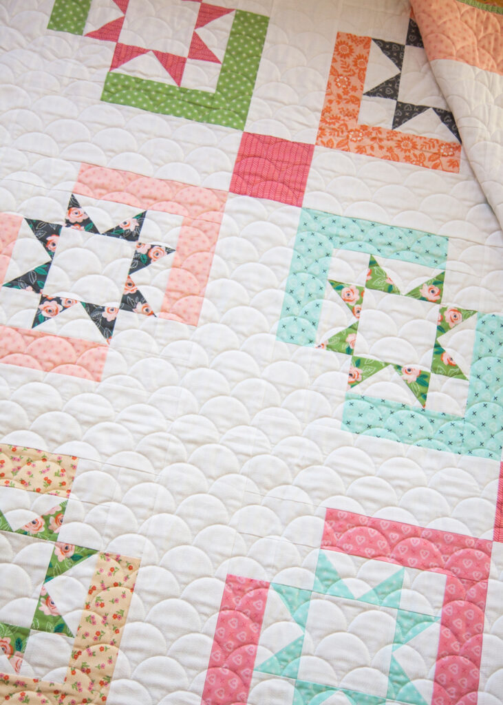 Star Crossed quilt by Lella Boutique. Make with with a Jelly Roll or Layer Cake. Fabric is Sugar Pie by Lella Boutique for Moda Fabrics
