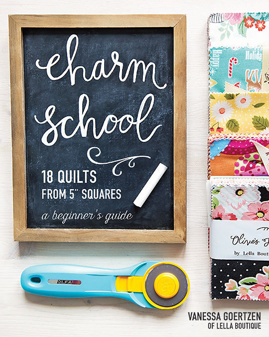Charm School quilt book free downloadable quilt pattern featured by top US quilt blogger, Lella Boutique. | Quilt Pattern by popular US quilting blog, Lella Boutique: Pinterest image of a black chalkboard with Charm School written on it, Charm City School quilt squares, and a rotary cutter. 