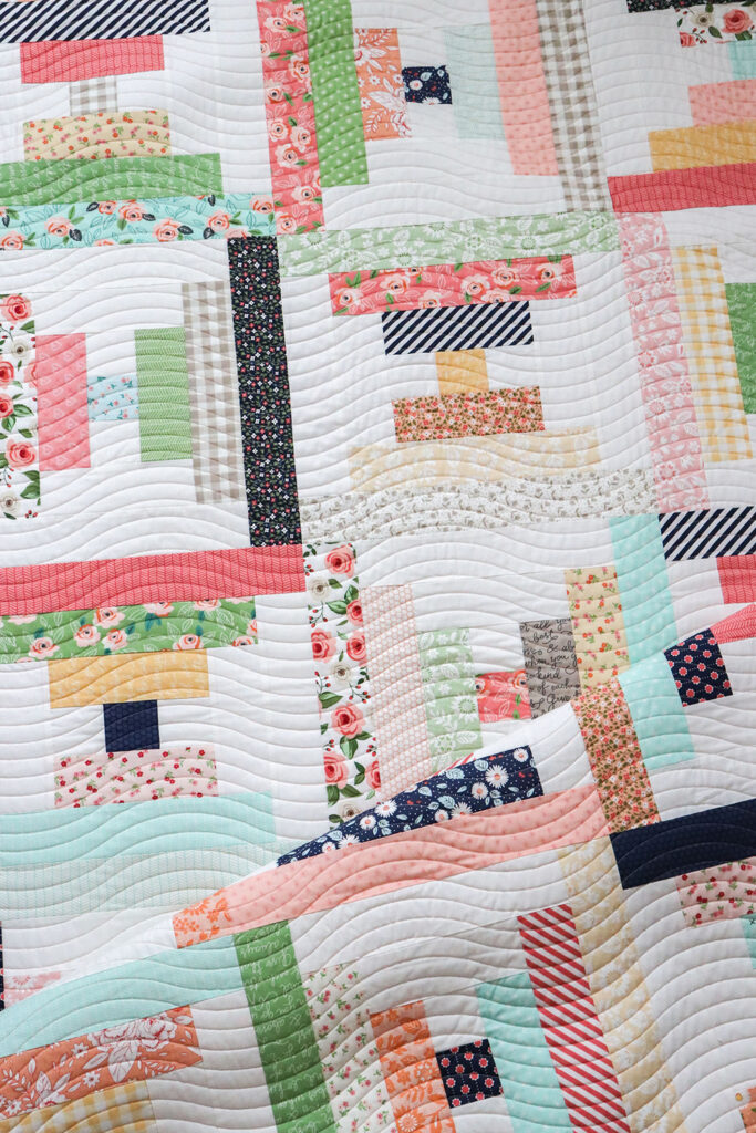 Parfait courthouse steps jelly roll quilt by Vanessa Goertzen of Lella Boutique. Pattern found in her book, Jelly Filled - 18 Quilts from 2-1/2" Strips