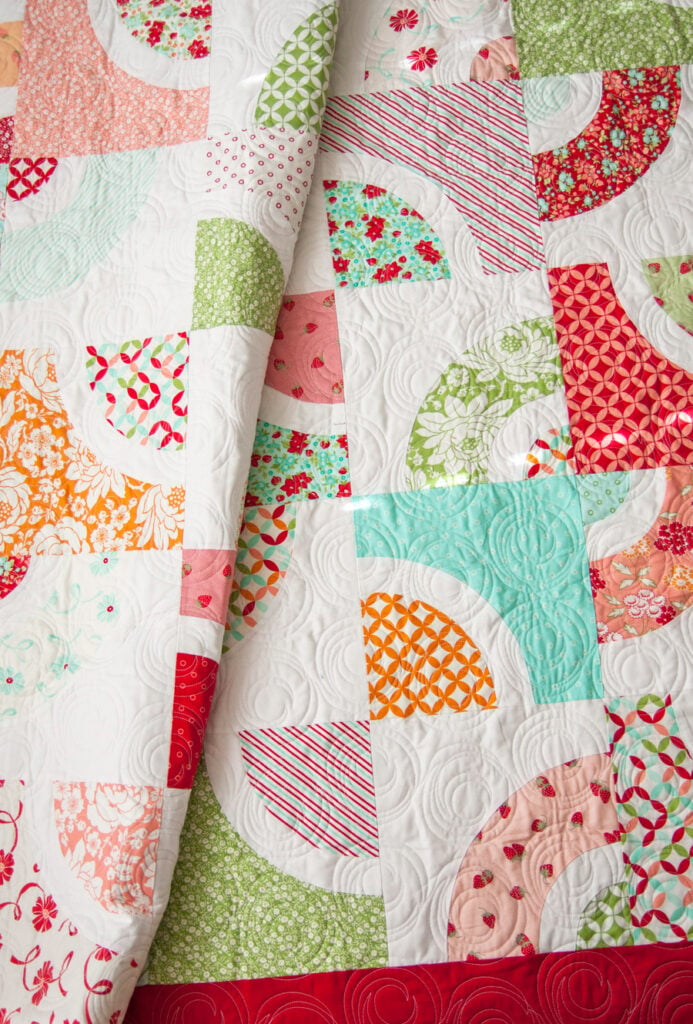 Dishes layer cake quilt by Vanessa Goertzen of Lella Boutique. Great intro to curved piecing. Fabric is Hello Darling by Bonnie & Camille for Moda Fabrics.