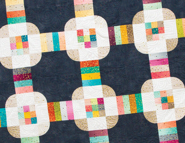 Hey Cupcake jelly roll quilt by Vanessa Goertzen of Lella Boutique. Fabric is Ombre Confetti by V & Co for Moda Fabrics