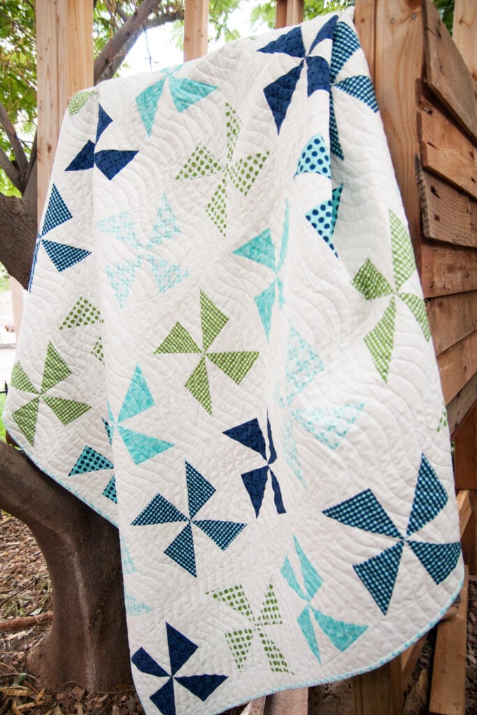 Shuffle charm pack quilt. Really cute pinwheel quilt in Gooseberry fabric by Lella Boutique for Moda Fabrics.