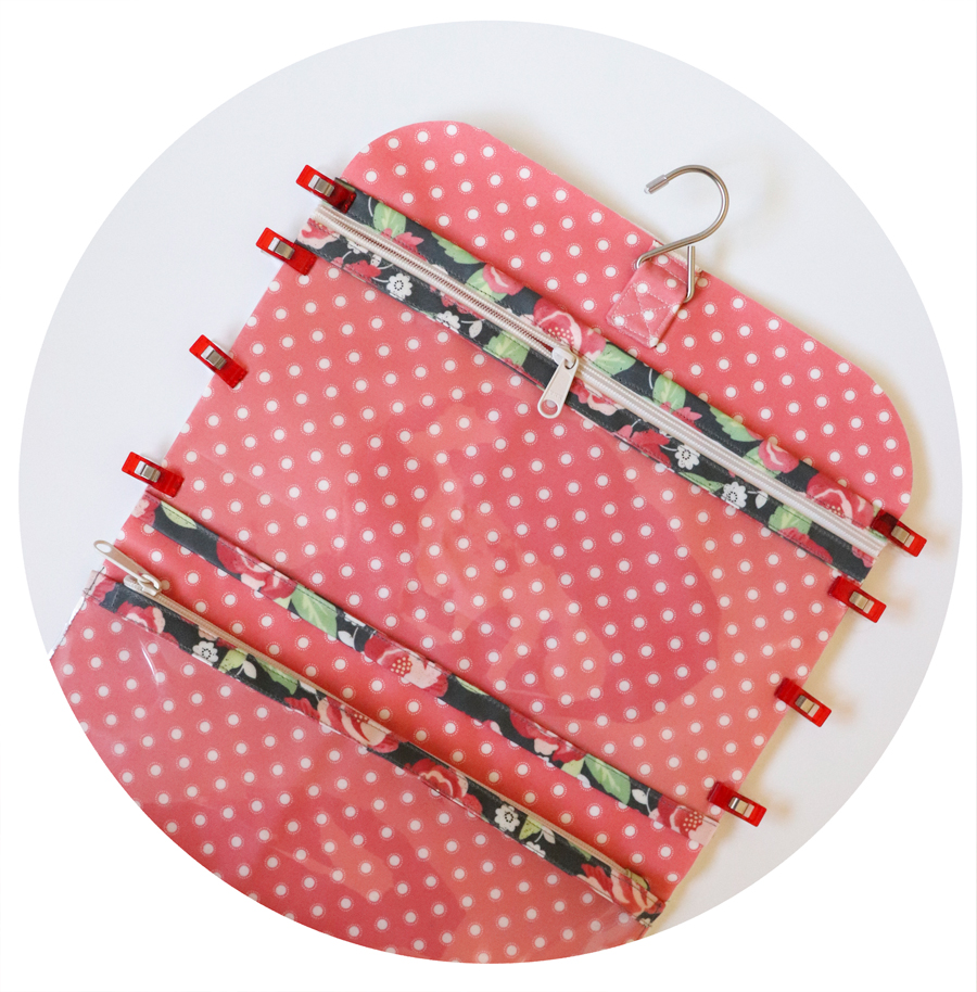 Kiss & Makeup Hanging Travel Bag by Vanessa Goertzen of Lella Boutique. Learn the tips and tricks of sewing with laminated cottons or coated prints.
