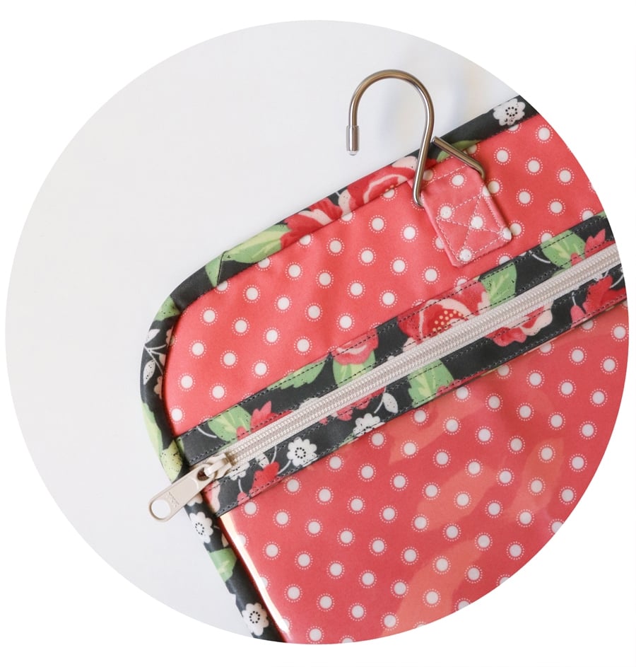 Kiss & Makeup Hanging Travel Bag by Vanessa Goertzen of Lella Boutique. Learn the tips and tricks of sewing with laminated cottons or coated prints.