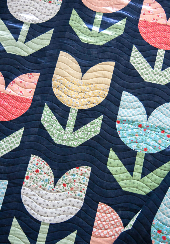 Holland tulip flower quilt PDF pattern by Lella Boutique. Great intro to curved piecing. Fabric is Garden Variety by Lella Boutique for Moda Fabrics