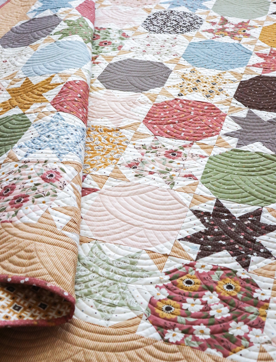 Starstruck 2 sawtooth star and snowball quilt by Lella Boutique. Make it with layer cakes or fat quarters. Fabric is Folktale by Lella Boutique for Moda