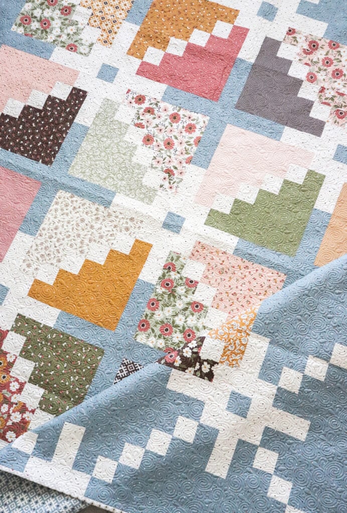 Sparkler quilt pattern by Lella Boutique. Make it with a layer cake. Fabric is Folktale by Lella Boutique for Moda Fabrics.