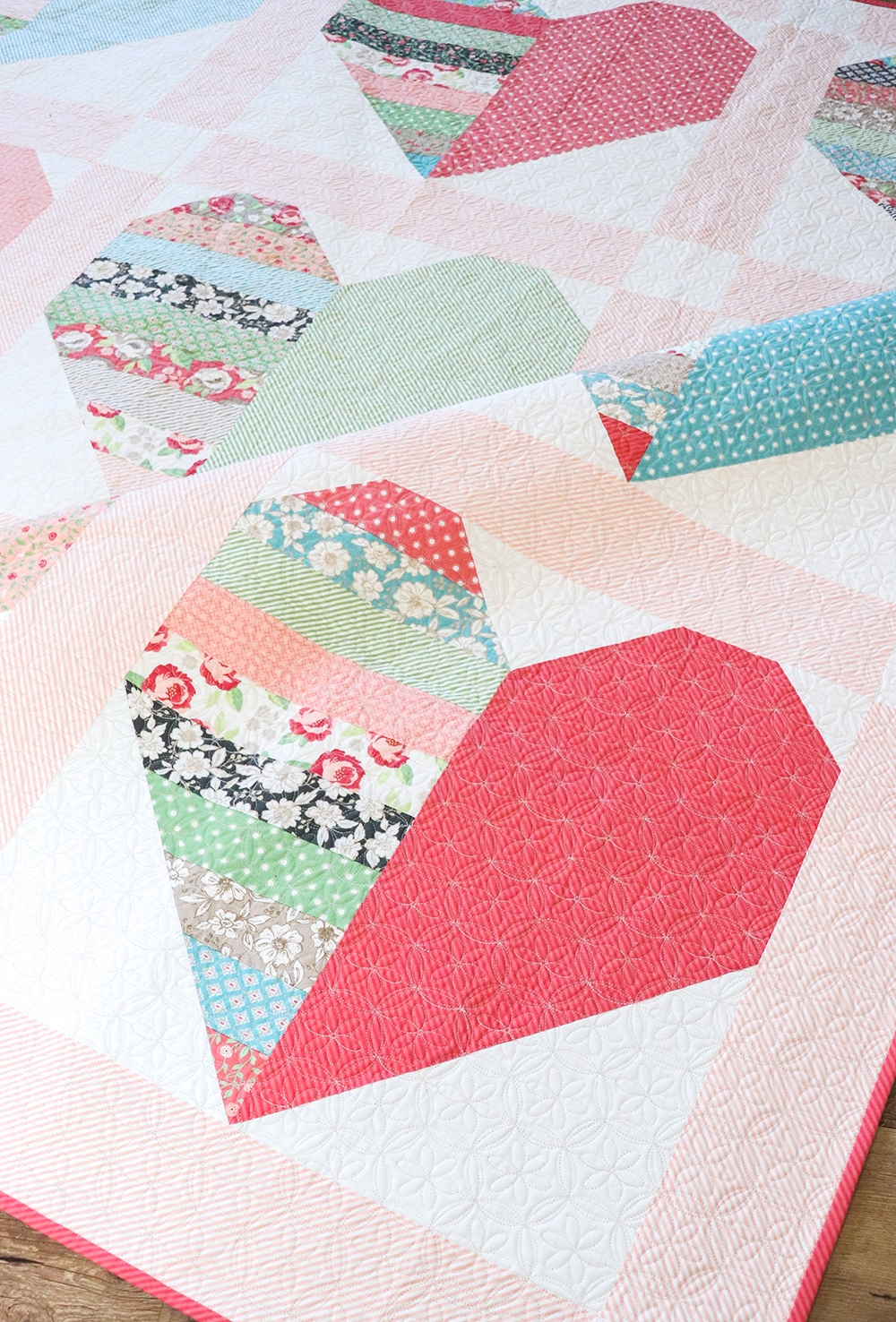 Heartthrob jelly roll heart quilt by Vanessa Goertzen of Lella Boutique. Pattern is from her book: Jelly Filled - 18 Quilts from 2-1/2" Strips. Fabric is Bloomington by Lella Boutique for Moda Fabrics.