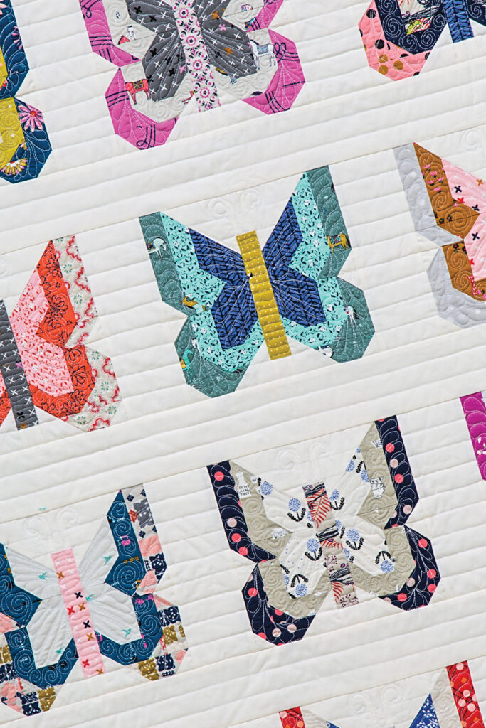 Madame Butterfly quilt by Lella Boutique. Pattern found in the book: Charm School - 18 Quilts from 5" Squares. Fabric is a variety of Cotton + Steel fabrics