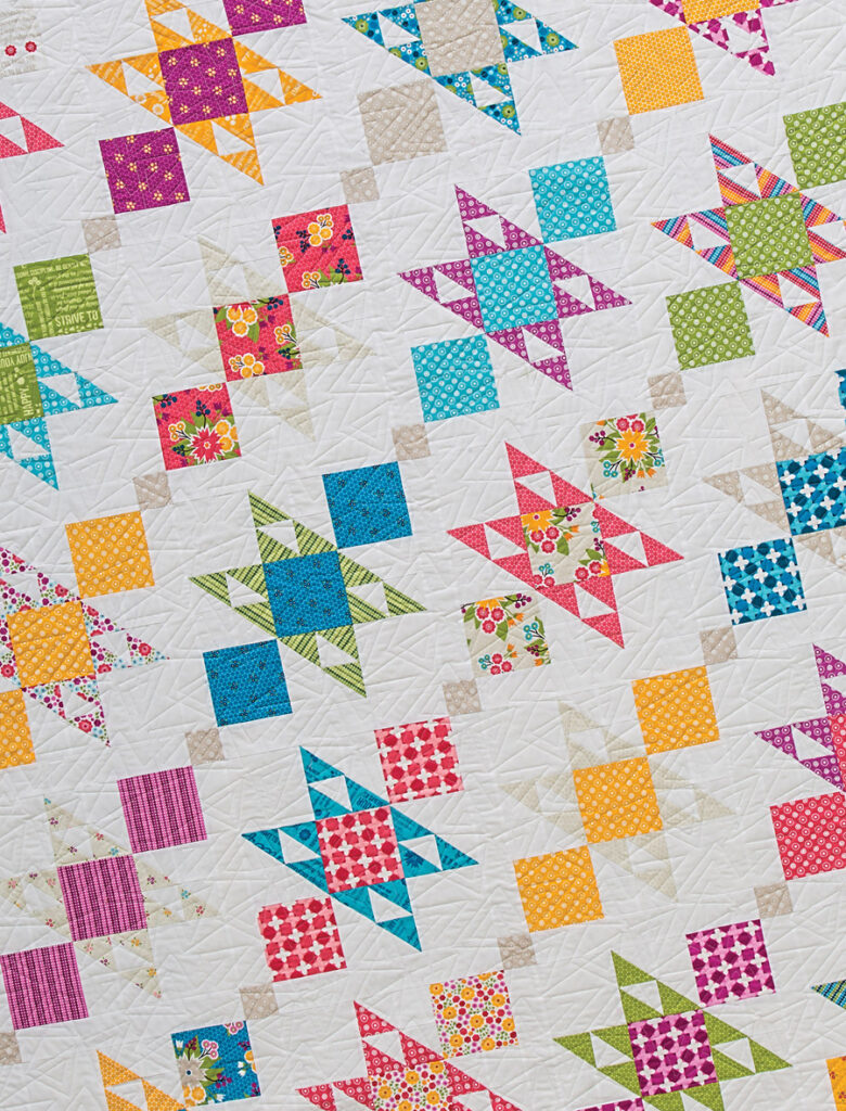 Charm Bracelet quilt by Lella Boutique. Pattern found in the book: Charm School - 18 Quilts from 5" Squares. Fabric is Meadowbloom by April Rosenthal for Moda Fabrics
