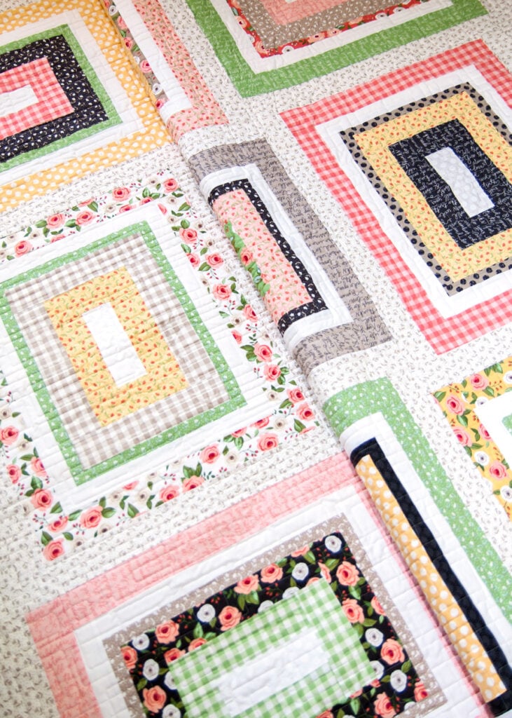 Kith & Kin jelly roll quilt by Lella Boutique. Make it with a Jelly Roll plus 9 fat quarters. Fabric is Farmer's Daughter by Lella Boutique for Moda Fabrics.