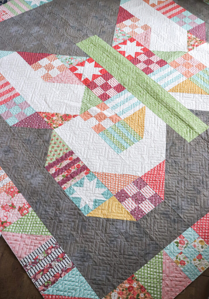 Butterfly Patch quilt PDF pattern. Scrappy butterfly pattern made with a layer cake. Fabric is Lollipop Garden by Lella Boutique for Moda Fabrics