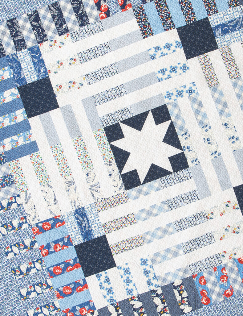 Potluck patriotic jelly roll quilt by Vanessa Goertzen of Lella Boutique. Pattern found in Jelly Filled - 18 Quilts from 2 1/2" Strips by Vanessa Goertzen of Lella Boutique. Fabric is Feed Sacks in True Blue by Linzee McCray for Moda Fabrics.