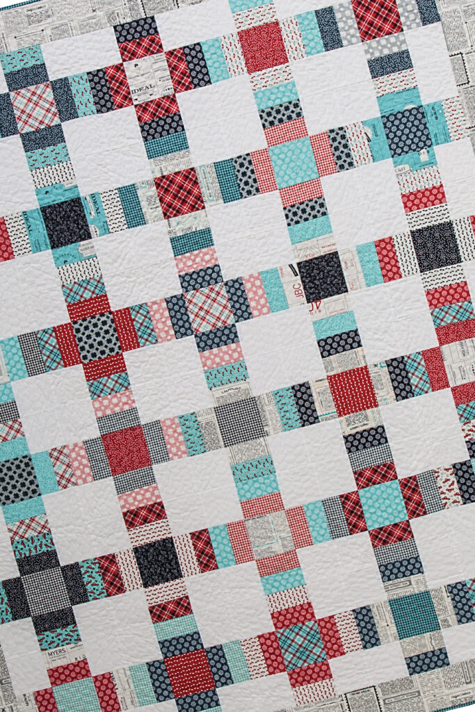 Railroad Crossing charm pack quilt by Vanessa Goertzen of Lella Boutique. Pattern found in the book: Charm School - 18 Quilts from 5" Squares. Fabric is Feed Company by Sweetwater for Moda Fabrics. Great coin quilt idea.