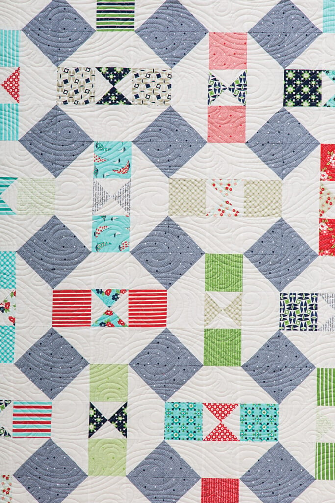 Somersault charm pack quilt by Vanessa Goertzen of Lella Boutique. Pattern found in the book: Charm School - 18 Quilts from 5" Squares. Fabric is Daysail by Bonnie & Camille for Moda Fabrics. Cute use of quarter-square triangles