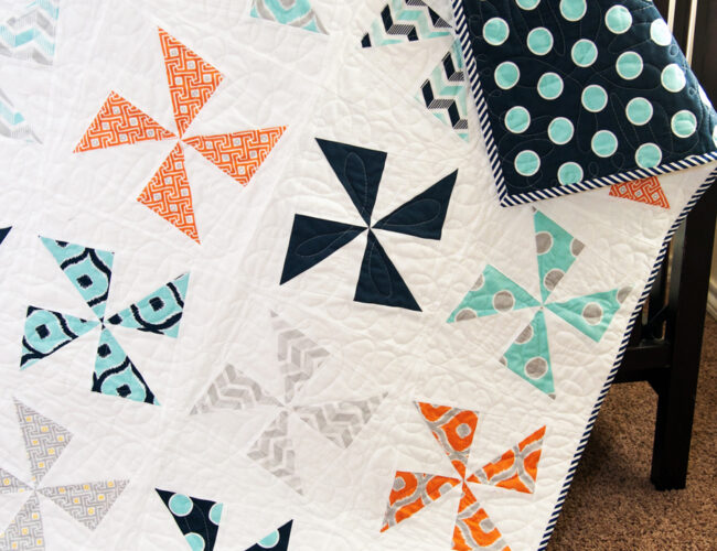 Shuffle pinwheel quilt by Vanessa Goertzen of Lella Boutique. Cool boy quilt made with charm packs or fat quarters. Fabric is Mixologie by Studio M for Moda Fabrics.