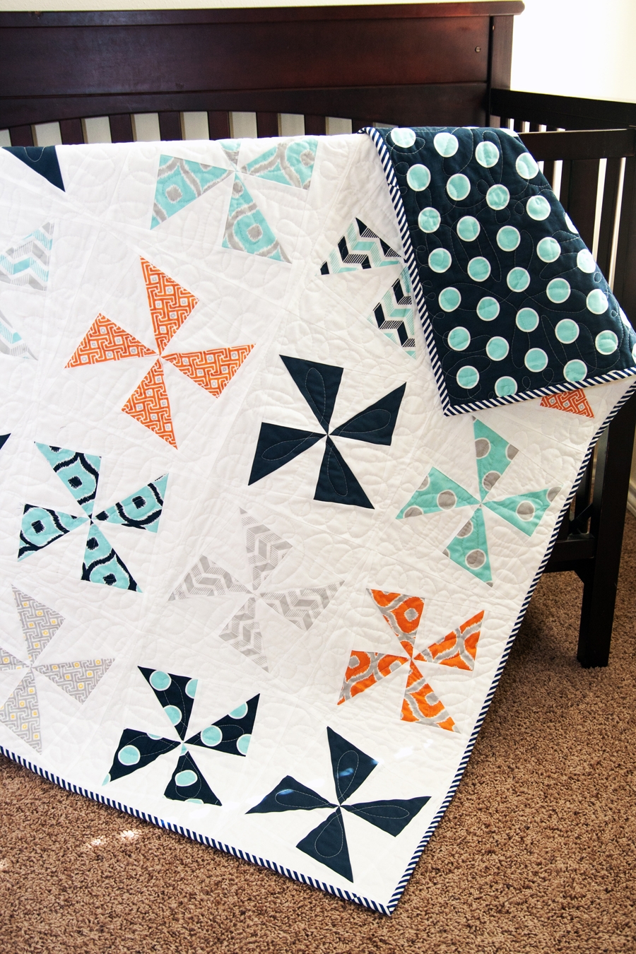 Shuffle pinwheel quilt by Vanessa Goertzen of Lella Boutique. Cool boy quilt made with charm packs or fat quarters. Fabric is Mixologie by Studio M for Moda Fabrics.