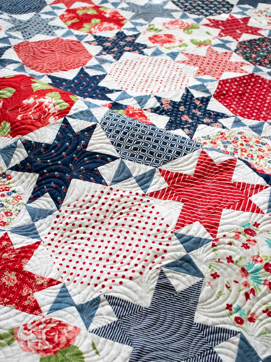 Starstruck 2 patriotic quilt in red white and blue. Make it with Layer Cakes or fat quarters. Fabric is Early Bird by Bonnie & Camille for Moda Fabrics.
