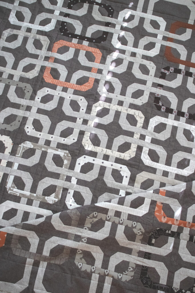Concord modern overlapping rings quilt. Honeybun friendly quilt pattern. Fabric is Smoke & Rust by Lella Boutique for Moda Fabrics.