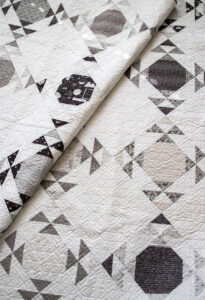 Moonwake fat quarter geometric quilt by Vanessa Goertzen of Lella Boutique. Fabric is Smoke & Rust by Lella Boutique for Moda Fabrics.