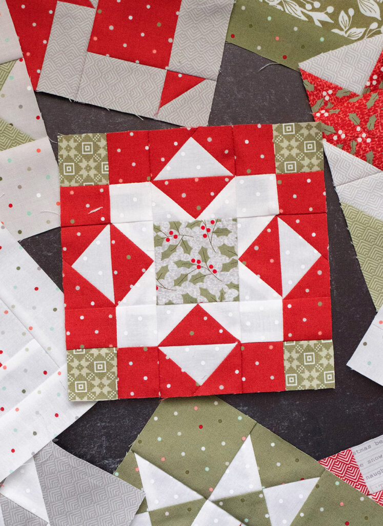 Sewcialites Quilt Along: Free Block of the Week. Block 12 is "Faithful" by Camille Roskelley of Thimble Blossoms. Fabric is Christmas Morning by Lella Boutique.