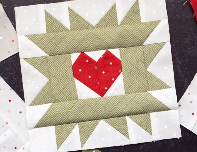 Sewcialites Quilt Along: Free Block of the Week. Block 18 is "Hearty" by Corey Yoder of Coriander Quilts. Fabric is Christmas Morning by Lella Boutique.