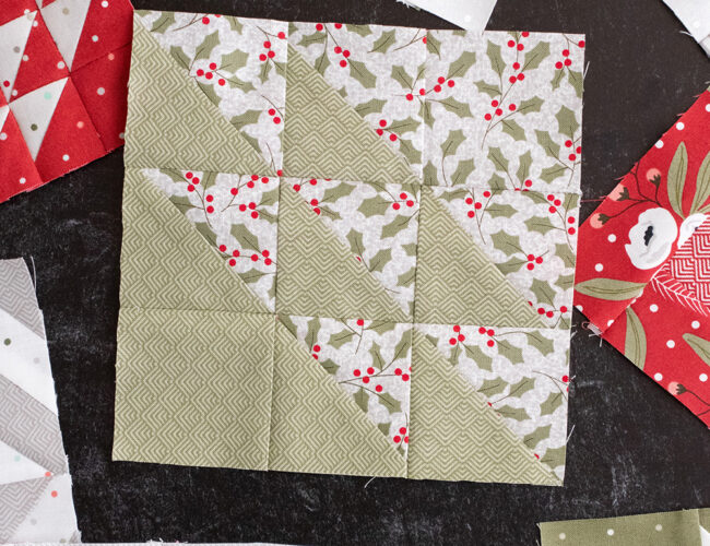 Sewcialites Quilt Along: Free Block of the Week by Fat Quarter Shop. Block 31 is "Noble" by Susan Ache. Fabric is Christmas Morning by Lella Boutique for Moda Fabrics.