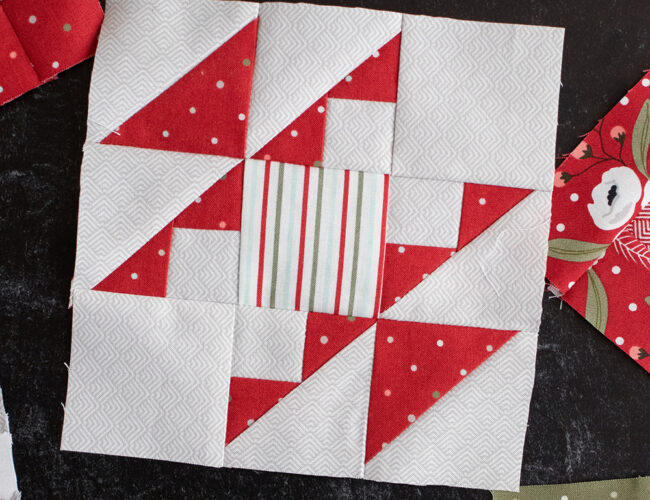 Sewcialites Quilt Along: Free Block of the Week by Fat Quarter Shop. Block 32 is "Bright" by Chelsi Stratton. Fabric is Christmas Morning by Lella Boutique.