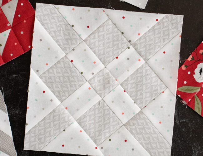 Sewcialites Quilt Along: Free Block of the Week by Fat Quarter Shop. Block 34 is "Passion" by Carrie Nelson. Fabric is Christmas Morning by Lella Boutique for Moda Fabrics.