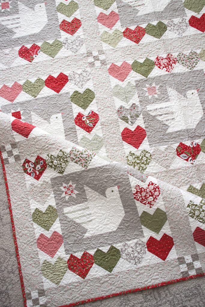 Lovey Dovey quilt by Vanessa Goertzen of Lella Boutique. Cute dove Christmas quilt using Christmas Morning fabric by Lella Boutique for Moda Fabrics.