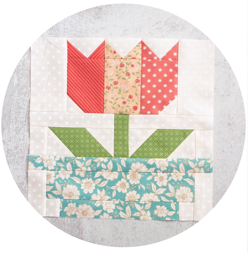 2020 Designer Mystery Quilt in Bloomington fabric by Lella Boutique for Moda Fabrics. Block 10 is "Tulip Tango" by Lisa Bongean. See the finished quilt and download the block patterns here!