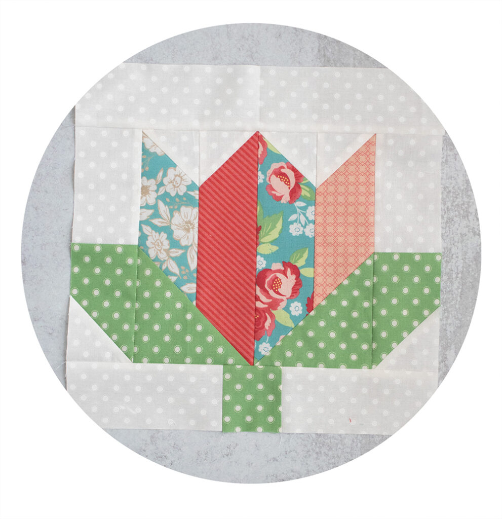 2020 Designer Mystery Quilt in Bloomington fabric by Lella Boutique for Moda Fabrics. Block 11 is "Fully Flora" by Chelsi Stratton. See the finished quilt and download the block patterns here!