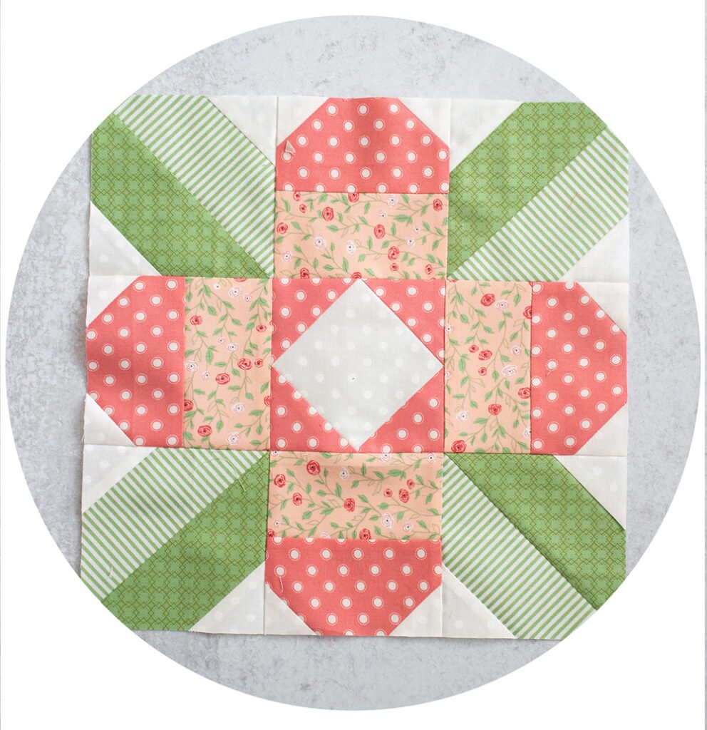 2020 Designer Mystery Quilt in Bloomington fabric by Lella Boutique for Moda Fabrics. Block 9 is "Dancing Dahlia" by Joanna Figueroa. See the finished quilt and download the block patterns here!