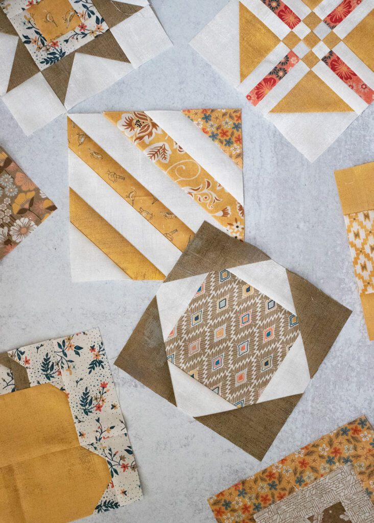 Sampler Spree Sew Along (Week 10). Check out Vanessa's blocks using Cider and Persimmon fabric by BasicGrey + her fall leaf quilt top layout.