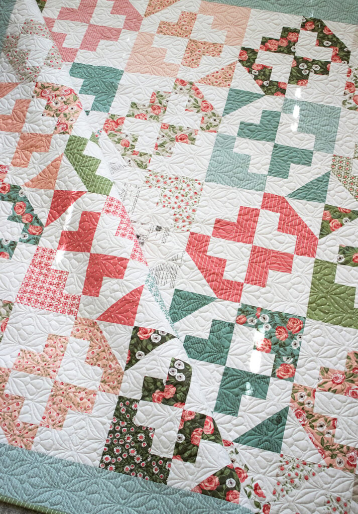  June Bug layer cake quilt in Love Note fabric by Lella Boutique for Moda Fabrics.