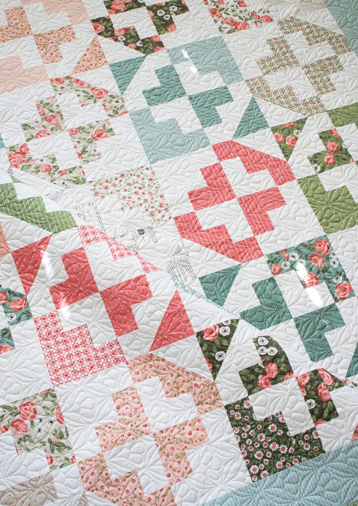 June Bug Layer Cake quilt by Vanessa Goertzen of Lella Boutique. Fabric is Love Note by Lella Boutique for Moda Fabrics.