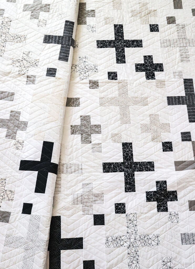 Sprinkles on Top jelly roll quilt. Really cool, graphic black and white plus sign quilt. Pattern is found in the book: Jelly Filled - 18 Quilts from 2-1/2" Strips by Vanessa Goertzen of Lella Boutique. Fabric is Catnip by Gingiber for Moda Fabrics.