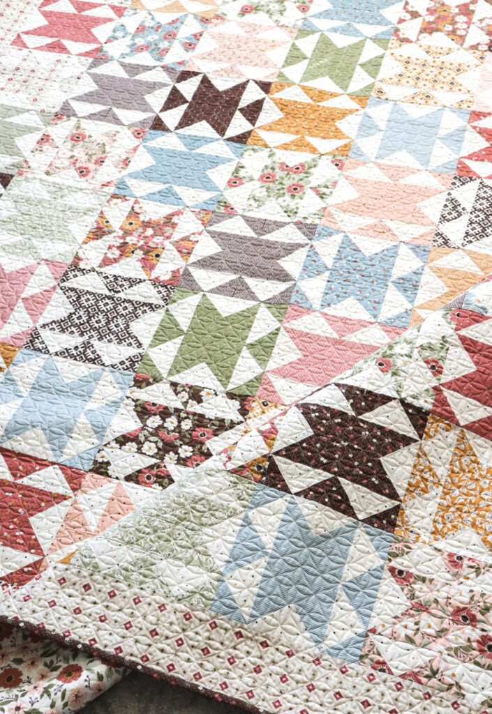 Chatterbox jelly roll quilt PDF pattern by Lela Boutique. Fabric is Folktale by Lella Boutique for Moda Fabrics.