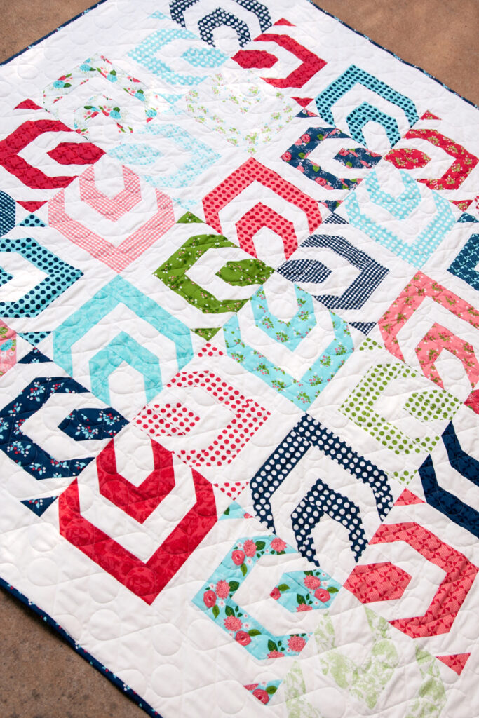 Kaleidoscope quilt pattern by Vanessa Goertzen of Lella Boutique. Fabric is Gooseberry by Lella Boutique for Moda Fabrics. Make it with 1 Jelly Roll.