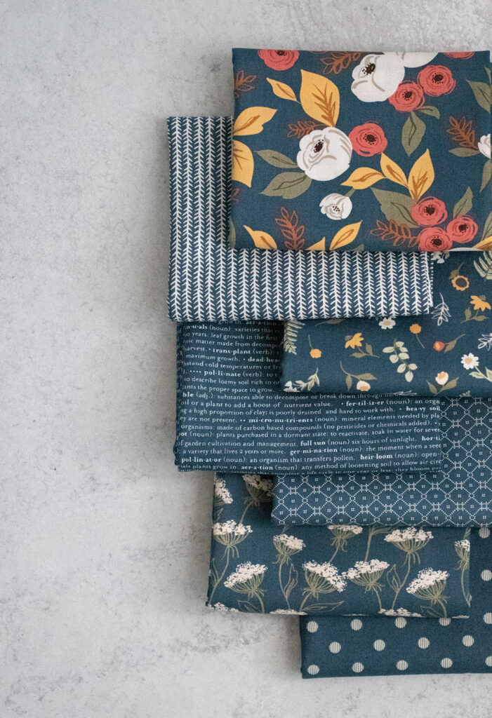 The navy colorway of Matching solids of Flower Pot fabric by Lella Boutique for Moda Fabrics.
