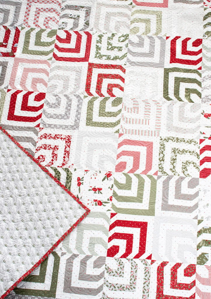 Kaleidoscope 2 quilt by Lella Boutique. Make it with 2 Honeybuns + 3 fat eighths. Fabric is Christmas Morning by Lella Boutique for Moda Fabrics.