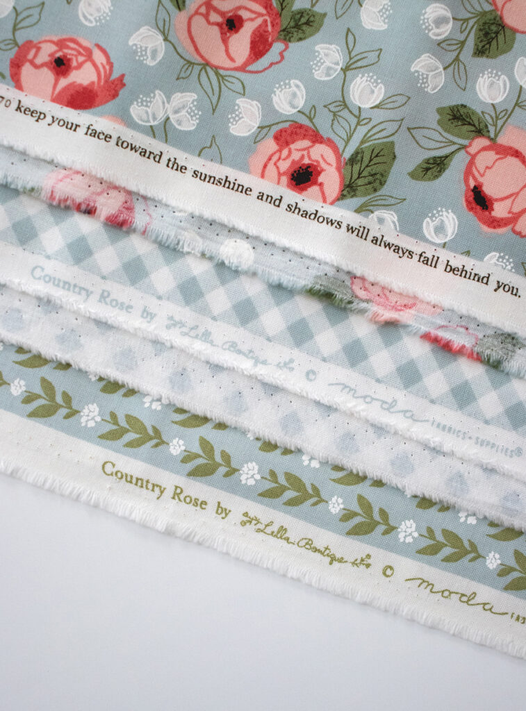 Selvedge of Country Rose fabric by Lella Boutique for Moda Fabrics. Expected in shops August 2022. Is a sister collection for to her popular Farmer's Daughter fabric collection.
