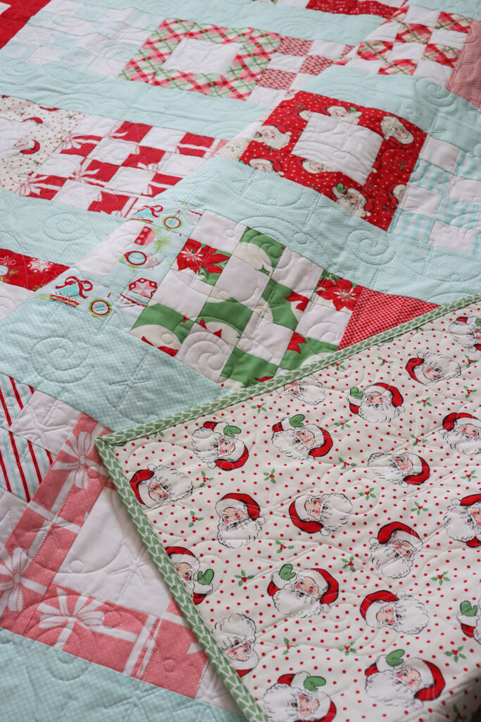 Petit Fours quilt by Lella Boutique. Pattern found in Jelly Filled - 18 Quilts from 2 1/2" Strips by Vanessa Goertzen of Lella Boutique. Fabric is Vintage Holiday by Bonnie & Camille + Swell Christmas by Urban Chiks for Moda Fabrics.